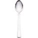 A silver Libbey stainless steel teaspoon with a white surface.
