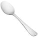 A silver dessert spoon with a white handle.