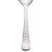 A silver Libbey stainless steel bouillon spoon with a white necktie.