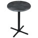 A Holland Bar Stool black steel round table with cross base.