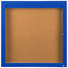 A blue Aarco enclosed bulletin board with a blue frame and key.