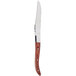 A Chef & Sommelier steak knife with a Cherry Pakkawood handle.
