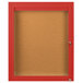 A red Aarco enclosed bulletin board with a glass door.