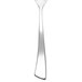 A Chef & Sommelier stainless steel dessert spoon with a white handle.