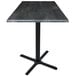 A Holland Bar Stool black steel laminate table with a metal base and square top.