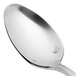 A close-up of a Chef & Sommelier stainless steel demitasse spoon with a silver handle.