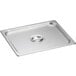 A stainless steel solid steam table pan cover on a stainless steel tray with a handle.