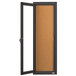 A bronze Aarco bulletin board cabinet with a cork board and glass door.