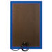 A brown rectangular bulletin board with a blue frame and a cord attached.