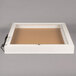 A white rectangular box with a white border and a cork board inside.