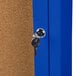 A blue Aarco enclosed bulletin board cabinet with a key in the lock.