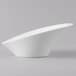 A close-up of a Schonwald Grace white porcelain Calla bowl with a curved shape.