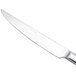 An Arcoroc stainless steel steak knife with a silver handle.
