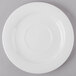 A Schonwald white porcelain tapas plate with a white rim on a gray surface.