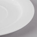 A close-up of a Schonwald Continental white porcelain tapas plate with a white rim.