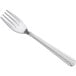 A silver fork with the Choice Dominion pattern on the handle on a white background.