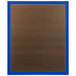 A brown bulletin board with a blue frame.