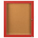 A red framed Aarco indoor bulletin board cabinet with a glass door and key lock.