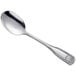 An Acopa stainless steel medium weight serving spoon with a design on the handle.