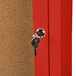 The red door of an Aarco lighted bulletin board cabinet with a key in the lock.