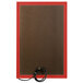 A rectangular brown board with a red frame and a black cord attached to it.