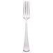 A Libbey stainless steel European dinner fork with a white handle.