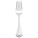 A close-up of a World Tableware Resplendence salad fork with a silver handle.