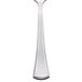 A Libbey stainless steel teaspoon with a curved design on the handle.