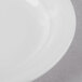 A close up of a Schonwald Avanti Gusto white porcelain micro plate.