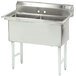 An Advance Tabco stainless steel two compartment pot sink with drain holes.