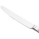 A Libbey stainless steel dinner knife with a serrated blade and solid handle.