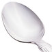 A Libbey stainless steel dessert spoon with a white handle.