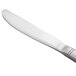 A silver bread and butter knife with a white handle.
