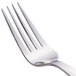 A close-up of a Libbey stainless steel dinner fork with a silver handle.