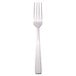 A silver Libbey Oceanside dinner fork with a white handle.