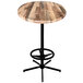 A round wooden Holland Bar Table with a rustic wood laminate top and foot rest base.