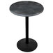 A round black steel laminate table with a black base.