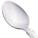 A Libbey stainless steel teaspoon with a white handle.