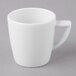 A Schonwald white porcelain espresso cup with a handle.