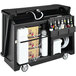 A black Cambro portable bar with bottles on it.