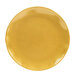 A close-up of a yellow Thunder Group Gold Pearl salad plate.