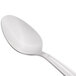 A Libbey stainless steel spoon with a white handle.