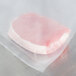 A piece of meat in a VacPak-It jumbo vacuum packaging pouch.