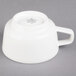 A white porcelain Villeroy & Boch tea cup with a handle.