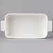 A white rectangular Villeroy & Boch baking dish with handles.