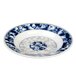 A blue and white Thunder Group Blue Dragon melamine soup plate with a dragon design.