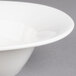 A close-up of a Villeroy & Boch white porcelain oval bowl.