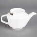 A Villeroy & Boch white porcelain teapot with a lid and handle.