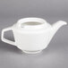 A white Villeroy & Boch porcelain teapot with a handle and spout.
