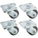 Four Beverage-Air plate casters with metal wheels and bolts.